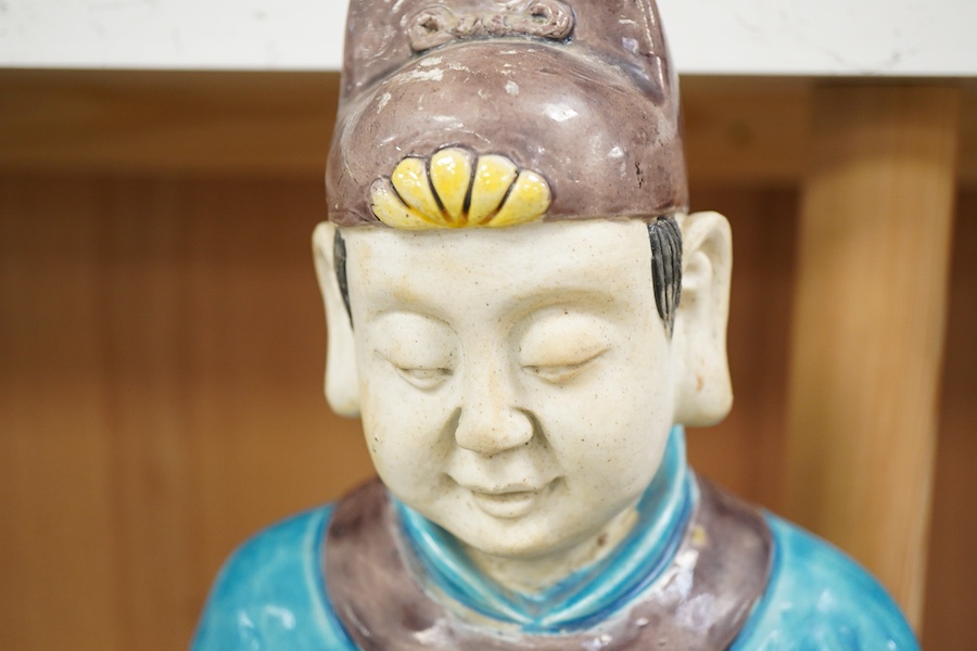 Two Chinese pottery glazed figures to include a Shiwan mudman, largest 48cm high